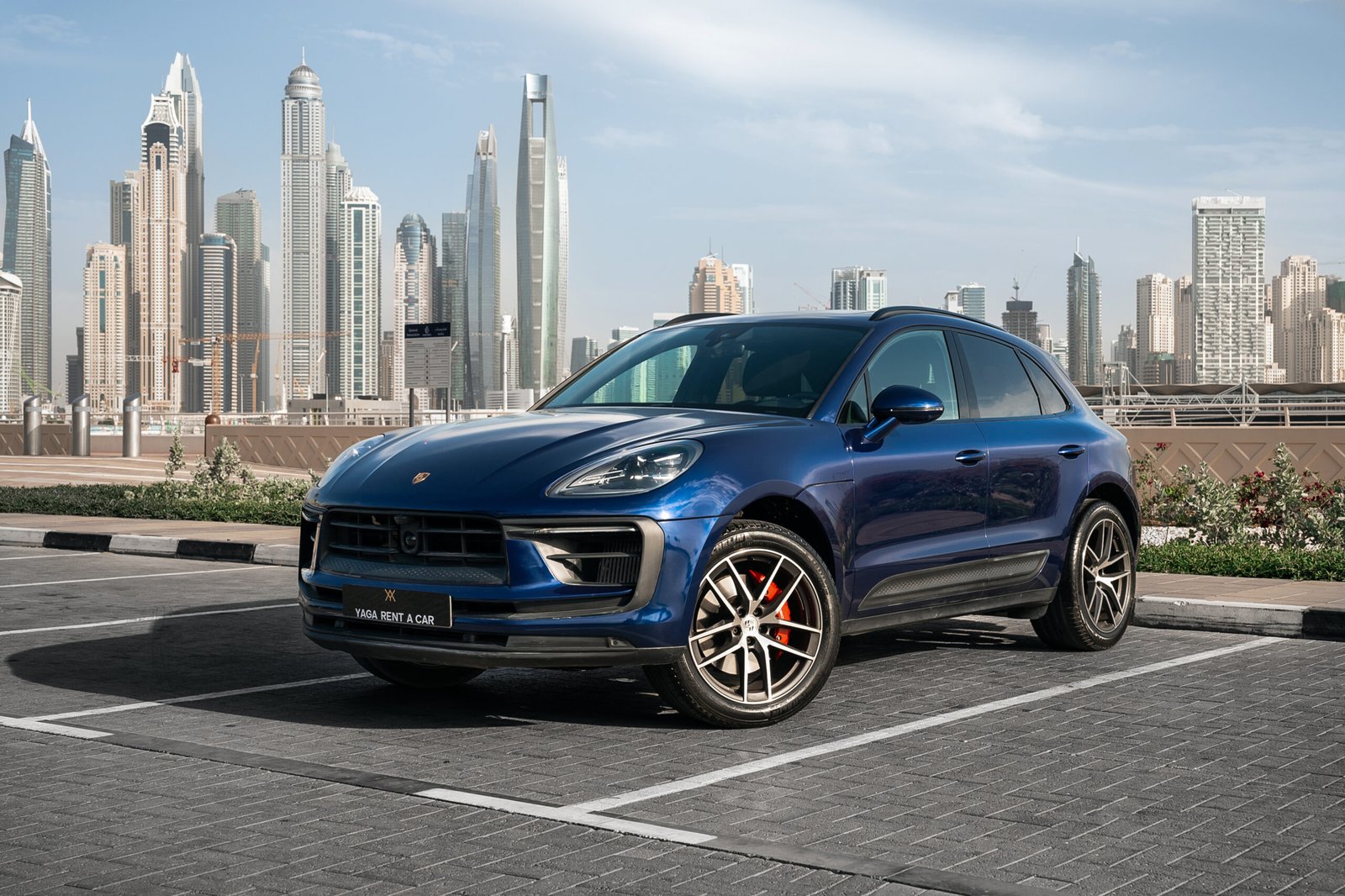 Porsche Macan S Luxury rental car parked outside Yaga Rent A Car showroom